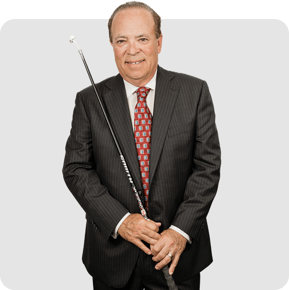 Professional man in a suit and tie holding a pool cue