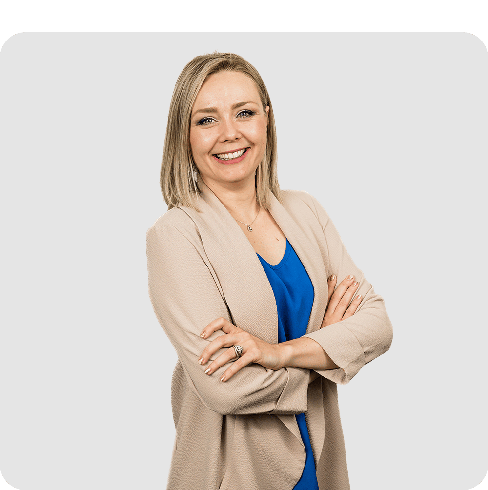 A professional woman posing with her arms folded