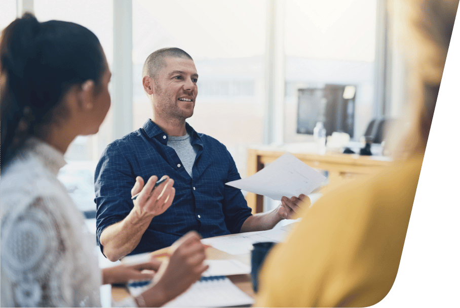 a group of employees having a meeting