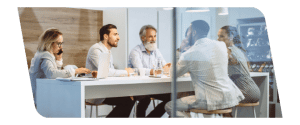 a group of people sitting at a table